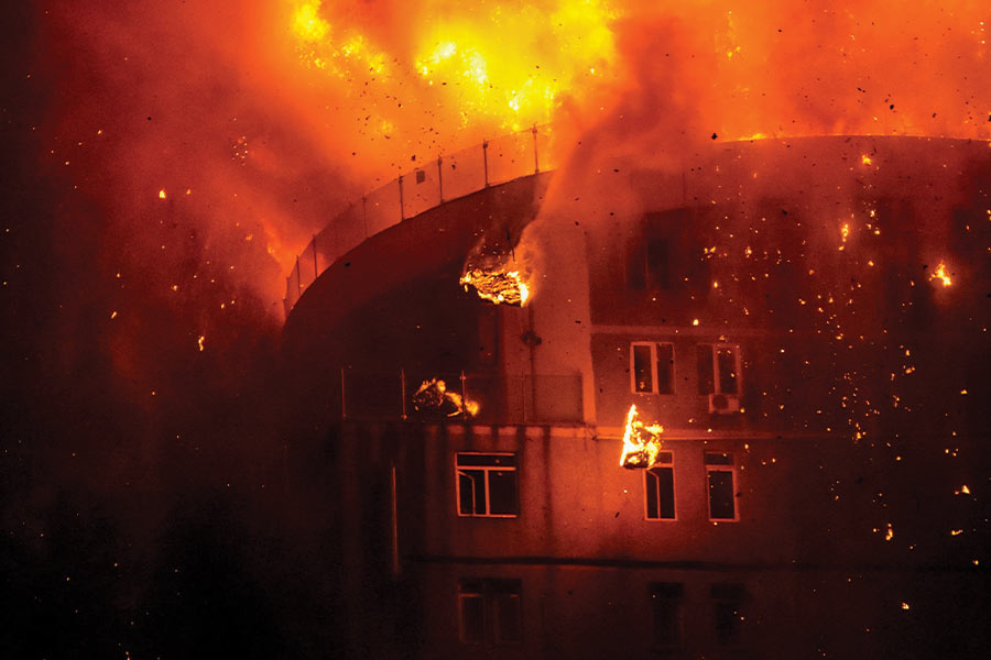 cost of fire risk assessment blog image of a building on fire, from pexels user Artem Makarov